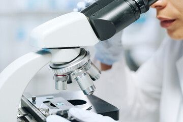 Aufkleber - Laboratory equipment for studying and researching new virus or bacteria used by young female virologist or biochemist during experiment