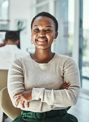 Poster - If you can dream it, you can do it. Portrait of a happy young businesswoman sitting in an office.