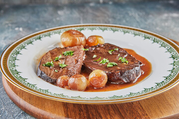 Wall Mural - Roast beef with reduced wine sauce and shallots