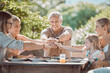 © Courtney H/peopleimages.com - To family. Shot of a family sitting together with their hands stacked in the middle.