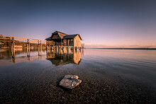 Traditional Boathouse At Lake Ammersee Near Munich, Bavaria, Germany At Sunrise.