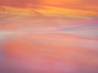 pink sunset at sea water reflection sun light on gold yellow clouds sky nature background