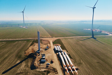 Windmill generator wing prepared for assembling on ground, Construction site for wind power generator building, Green power and renewable energy