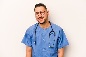 Wall Mural - Hispanic nurse man isolated on white background happy, smiling and cheerful.