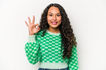 Young hispanic woman isolated on white background cheerful and confident showing ok gesture.