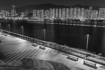 Wall Mural - Seaside Promenade and skyline of Harbor in Hong Kong city at night