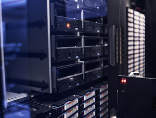 Sticker - All your data, safe and secure. Cropped shot of a large, dark and empty server room.