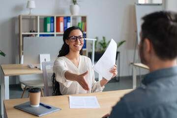 Poster - Happy HR manager holding CV, offering handshake to job applicant during employment interview at modern office