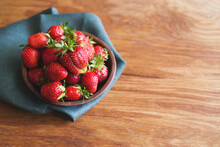 Fresh Juicy Strawberries In A Plate On A Wooden Table Surface, Top View, Copy Space. Summer Berry Harvest