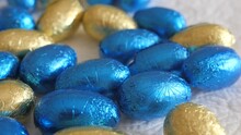 Easter Eggs, Chocolate In Blue And Yellow Colors Of The Flag Of Ukraine. Stand With Ukraine. Ukraine Flag Colors. Shot In 4k