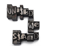 Closeup Lead Letters United We Stand White Background