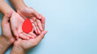 © Reza - Hands holding blood drop, world blood donor day concept