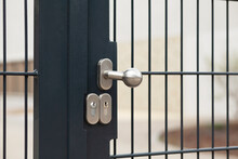 Gate Lock On Metal Fence.  Modern House Gate Handle. Doorknob. 