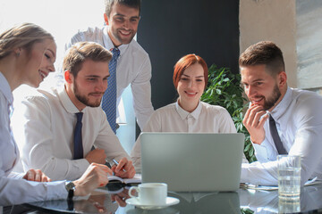 Wall Mural - Group of business partners discussing ideas and planning work in office.