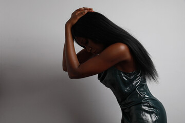 Wall Mural - Young woman posing on white background. Long hair and ideal skin.