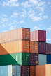 © Jezper - Shipping containers stacked against blue sky