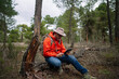 © karrastock - Man using a tablet in the forest.