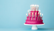 Extravagant Pink Tiered Birthday Cake With Lots Of Gold Birthday Candles