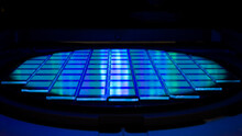 Silicon Wafer With Chips In UV Lighting. Neon. Ultraviolet Lithography.