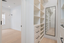 Custom Closet Organization. Contemporary Closet Design With Shelves, Drawers And Rods.