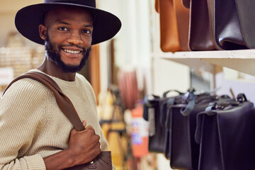 Aufkleber - Always try to connect with people and resources. Shot of a young man working at his job in a shop.
