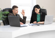 © Olga - Businessman and businesswoman meeting In modern office