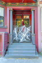 Facade Of A House With Fake Holloween Spider Webs At The Front Gate In San Francisco, California