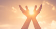© kieferpix - Hands reaching out to sky, warm sunshine in the palm of hands.	 Spiritual prayer, recovery, healing concept.