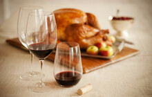 Two Glasses Of Red Wine In Front Of A Thanksgiving Turkey