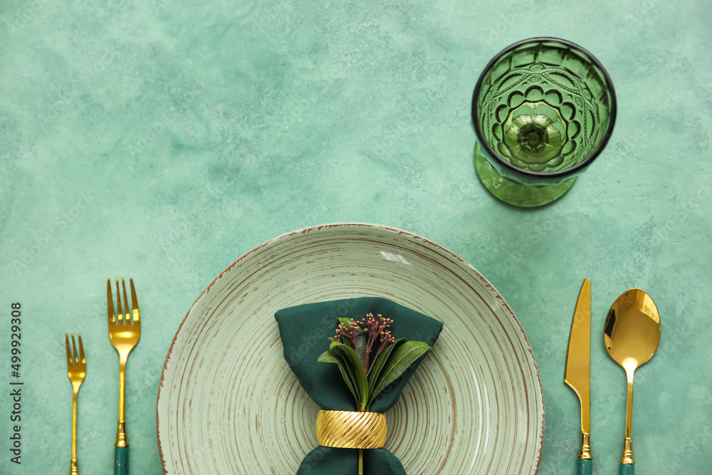 Elegant table setting on green background