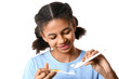 African-American teenage girl applying tooth paste onto brush on white background