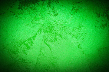 Texture of green decorative plaster or concrete with vignette.