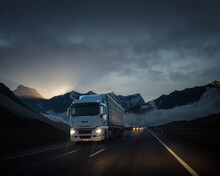 Truck Delivering Goods  In A Beautiful And Dramatic Scenery At Sunset