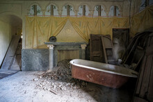 Bathroom With Iron Tub In Old Abandoned House
