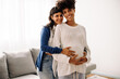 © (JLco) Julia Amaral - Cheerful pregnant couple smiling at the camera