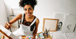 © (JLco) Julia Amaral - Happy art painter drawing on a canvas in her art studio