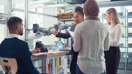 Aufkleber - Black Senior Engineer Explaining Information to People Look at Robot Limb. People Hold Devices and Discussing. Optimisation of Autonomous Manufacturing Facility that Creates Great Products Concept