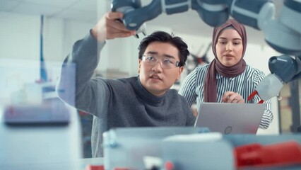 Aufkleber - Arabic Female Future Engineer Look How Work Skilful Developer. Asian Man Explains and Examining Robot Arm. Analysing and Evaluating Prototypes and Robotic Systems
