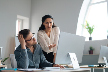 Poster - Displeased female boss scolding upset subordinate, pointing at mistake in business project at office