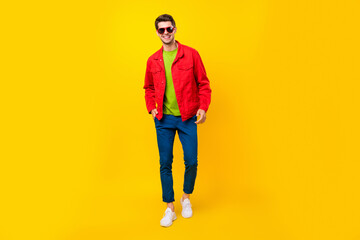 Poster - Full length body size view of attractive cheerful guy walking strolling good mood isolated over bright yellow color background