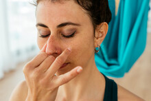 Woman Doing Breathing Exercise During Yoga Session