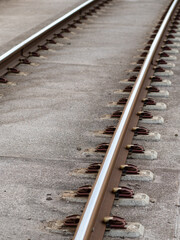 Canvas Print - tram tracks closeup on a concrete base