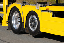 View On Truck Wheels And Tires On Yellow Truck Chassis.