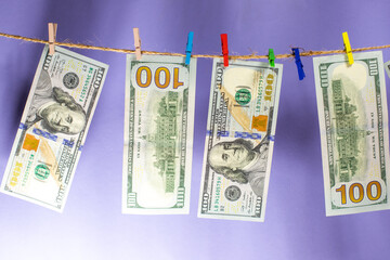 Poster - money is dried on a lace attached with clothespins