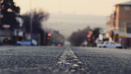 Selective shot from the level of the dividing line on a blurred background of the city