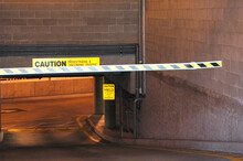 Closeup Of A Black And Yellow Boom Barrier (schlagbaum) At An Underground Parking In The Daylight