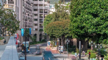 Wall Mural - Traffic on a street near water fountain and gardens timelapse near Monte-Carlo Casino.