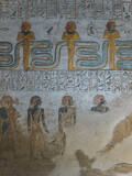 Closeup shot of an ancient painting with bas-reliefs made on the wall in Egypt