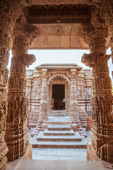 Wall Mural - Beautiful shot of old stone arch building with stairs in Dilwara Temples in Mount Abu, India