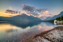 Breathtaking View Of Lake McDonald With A Dock At Sunset In Glacier National Park, Montana